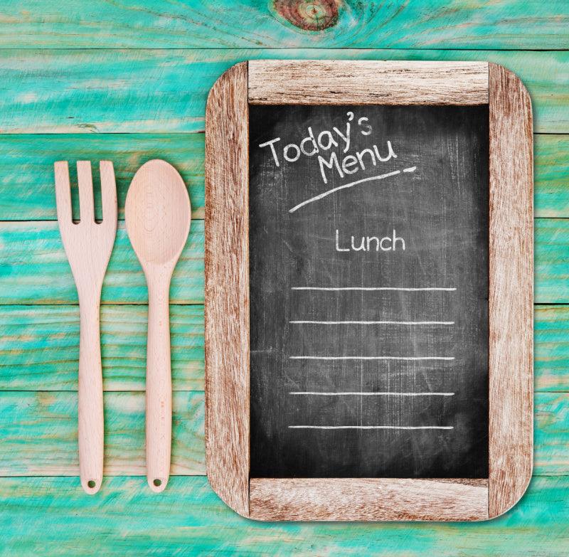 chalkboard and cutlery with today's lunch menu